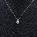 COLLAR ACERO DORADO PERLA Y CIRCONITA